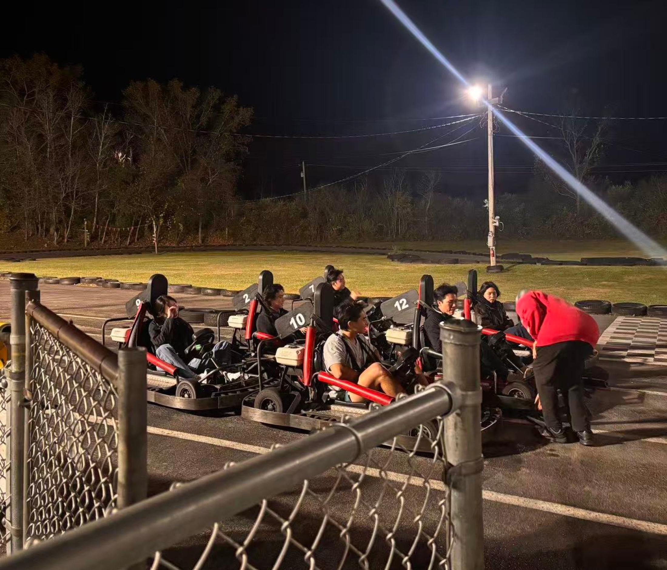 Go-karts lined up at night
