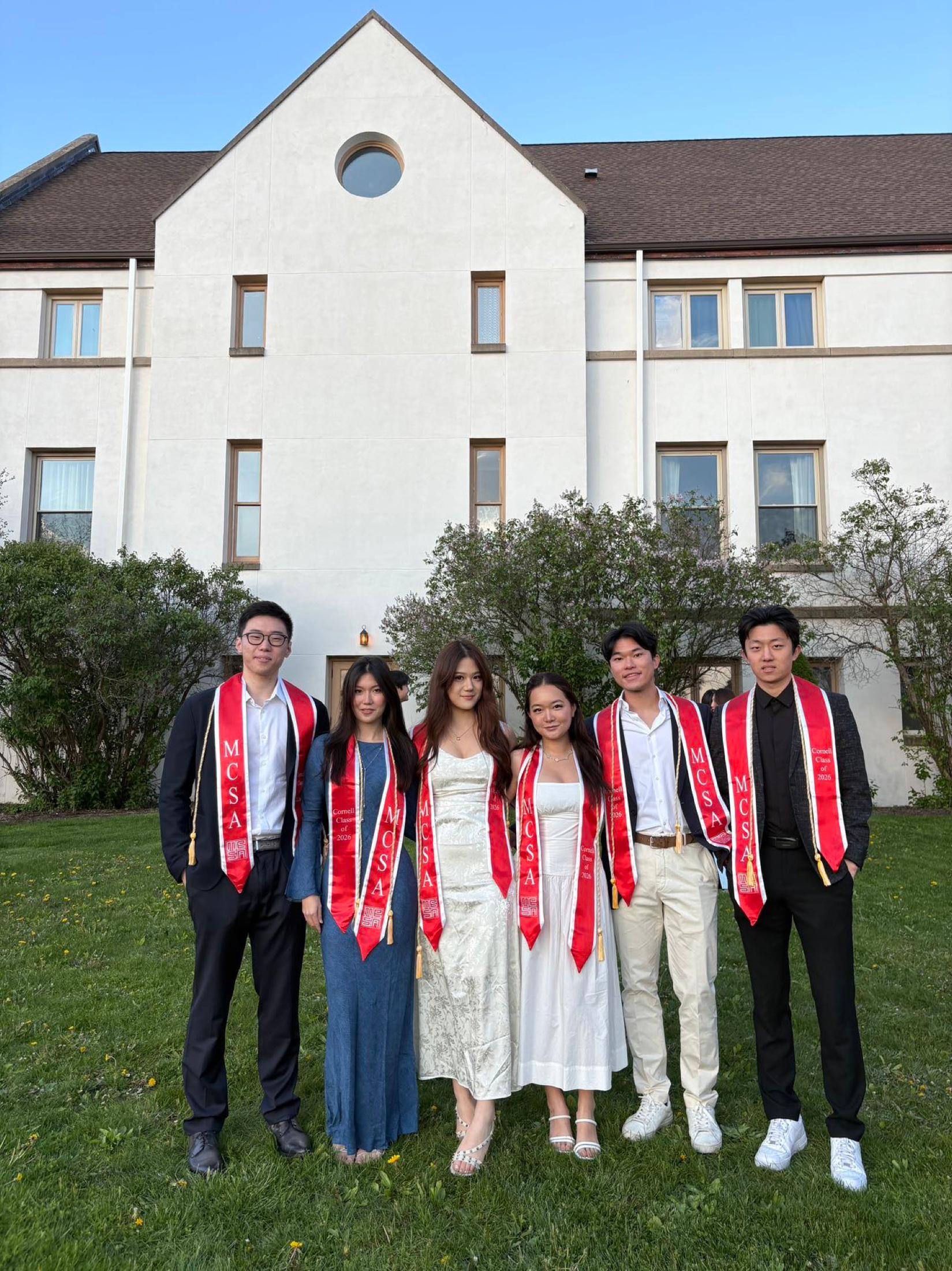 Graduating seniors posing outdoors